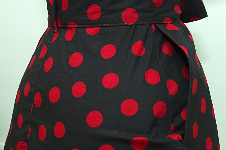 Black dress with red polka dots, pockets